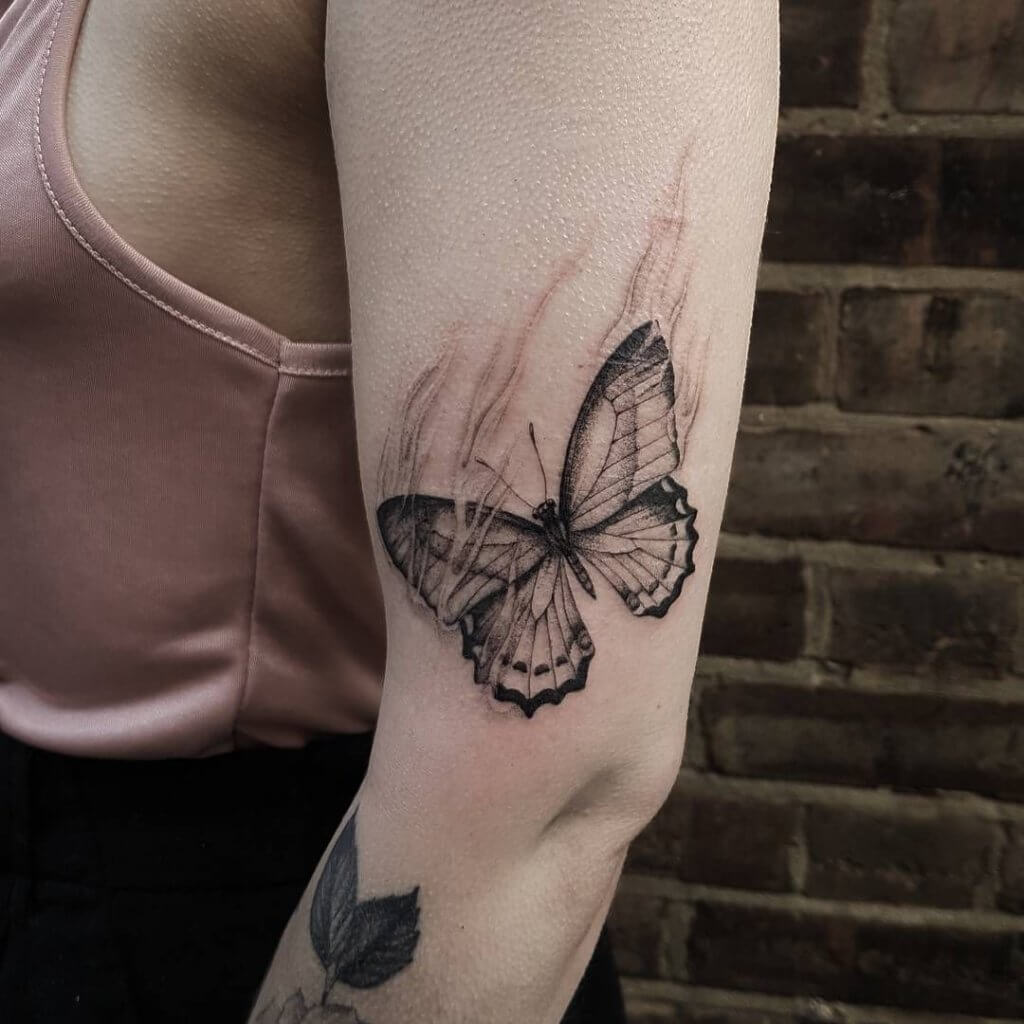 grey butterfly tattoo