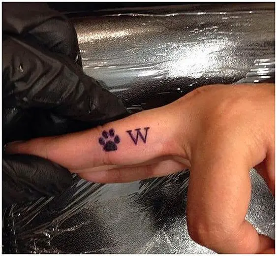 Dog Paw finger tattoo