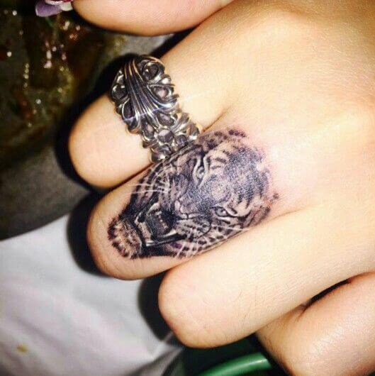 Fierce Tigress finger tattoo