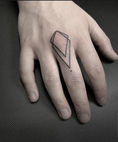 Geometric finger tattoo