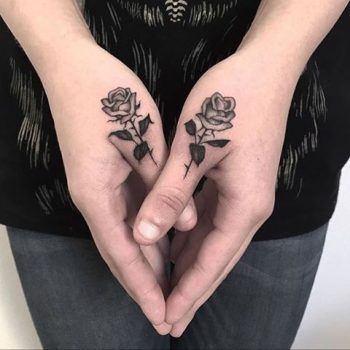 black rose finger tattoo