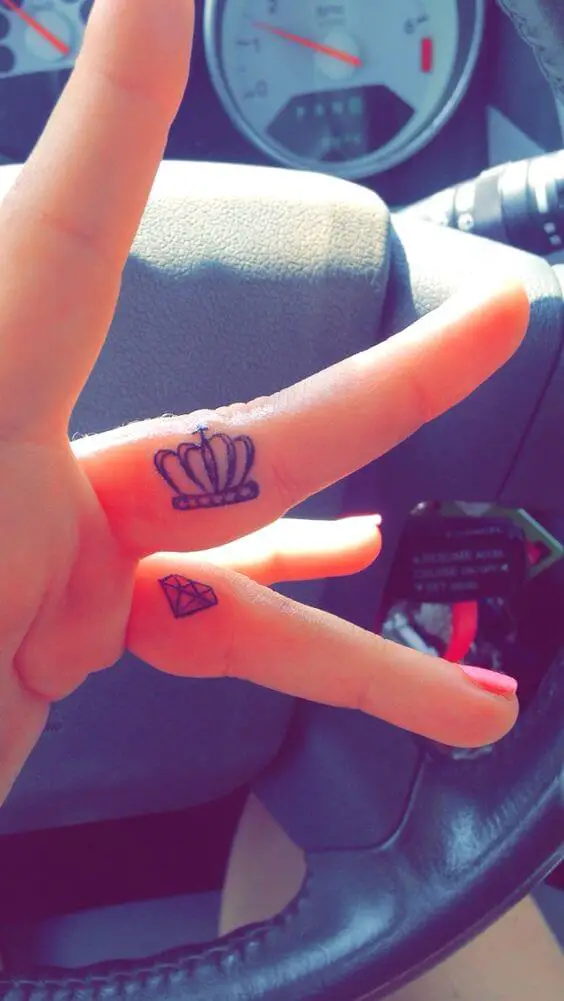 crown and diamond finger tattoo