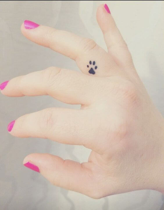 small Dog Paw finger tattoo