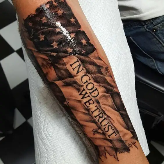 Tattered American Flag Tattoo On Forearm