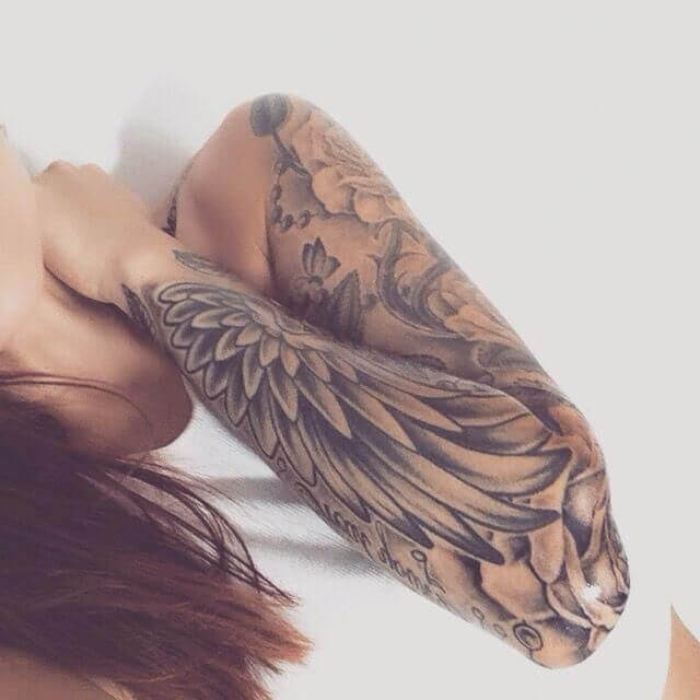 15 examples Angel wings tattoo on arm as symbol of protection