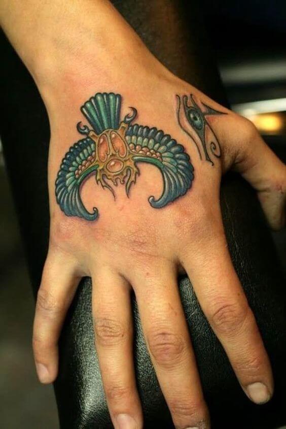 insect tattoo on hand
