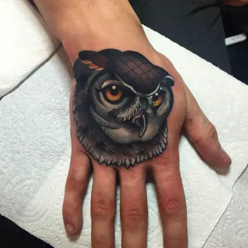 neo traditional owl tattoo on hand