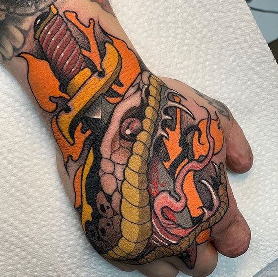 neo traditional snake tattoo on hand
