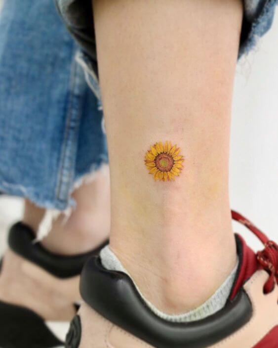 small coloured sunflower tattoo