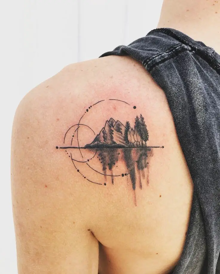 Mountains tattoo located on the side boob