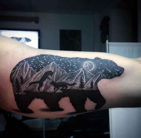 Bear in a forest sunset behind the mountains tattoo idea  TattoosAI