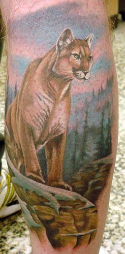 Lion on Mountain Tattoo