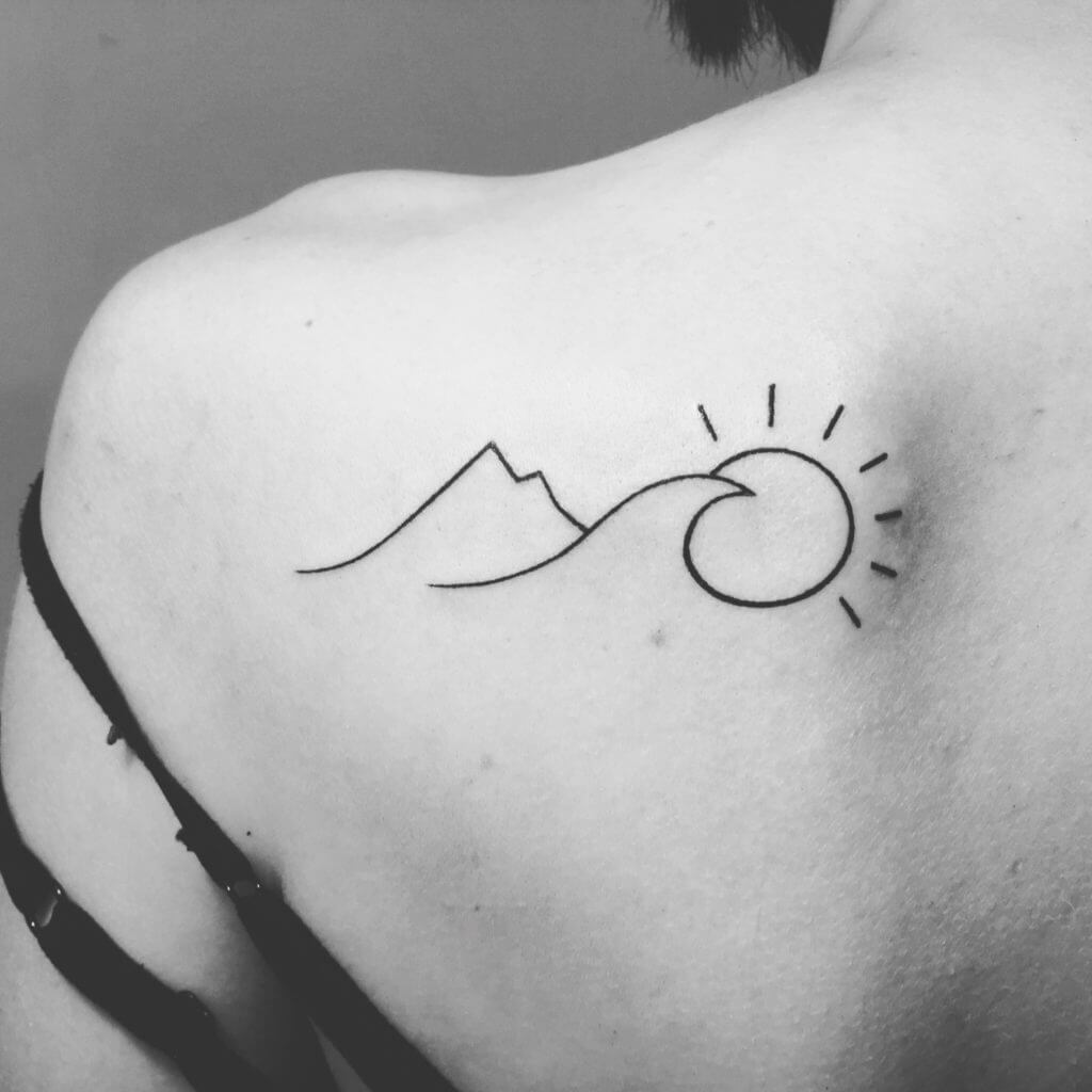 Minimalist mountain with sun and a wave tattoo