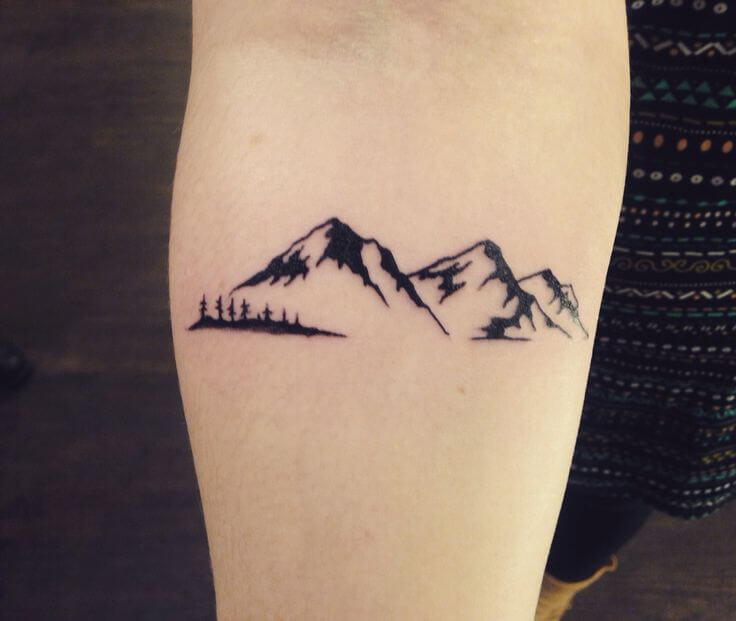 Small mountain wrist tattoo