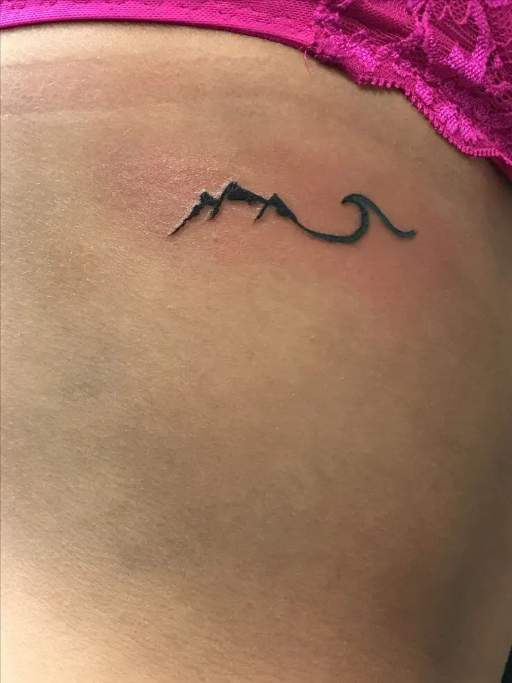 Tiny Mountain and wave tattoo