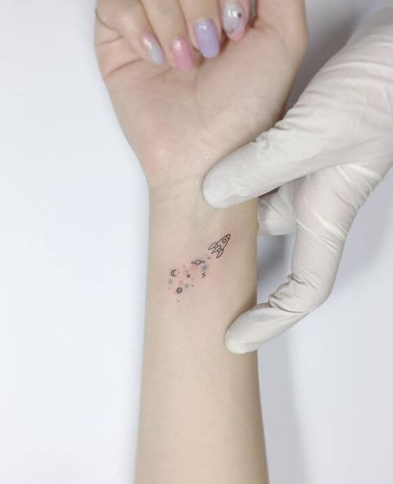 Wrist Small Rocket And Stars Tattoo