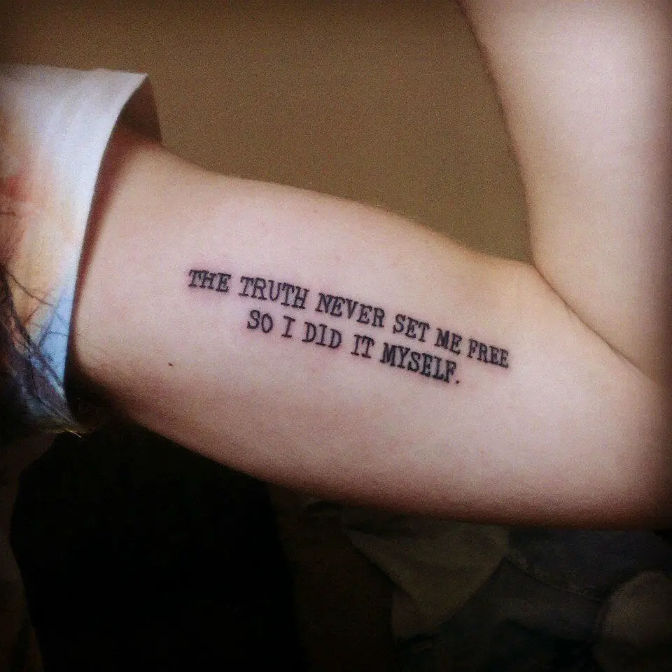 Black Ink Quote Bicep Tattoo