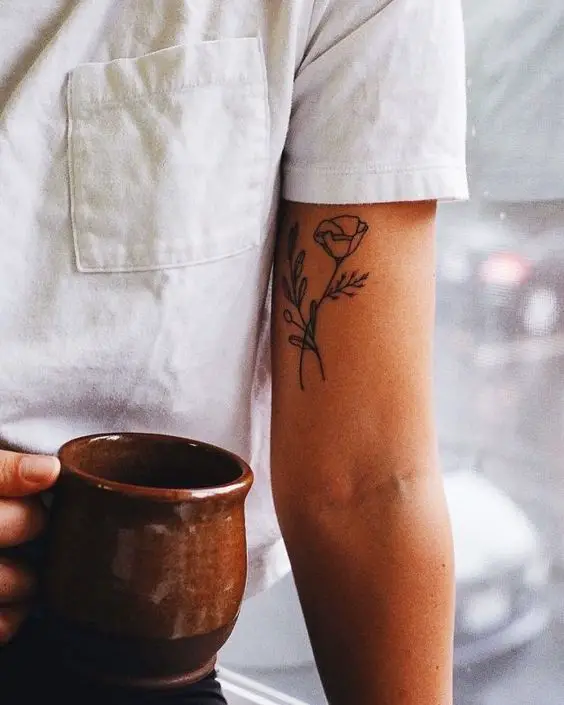 small floral bicep tattoo