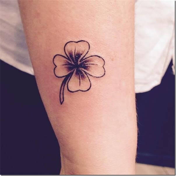 small single flower Thigh tattoo