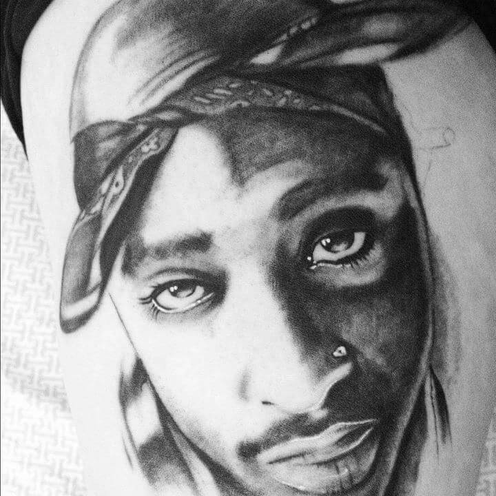 black and grey portrait tattoo artist