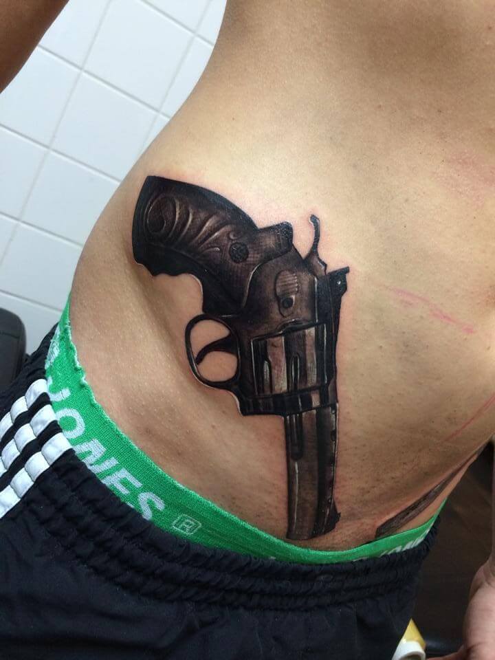 hips gun tattoo