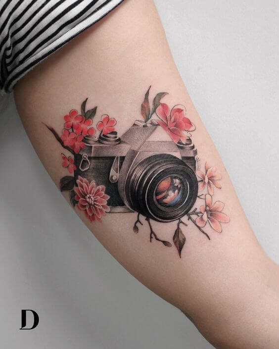 camera and flowers tattoo
