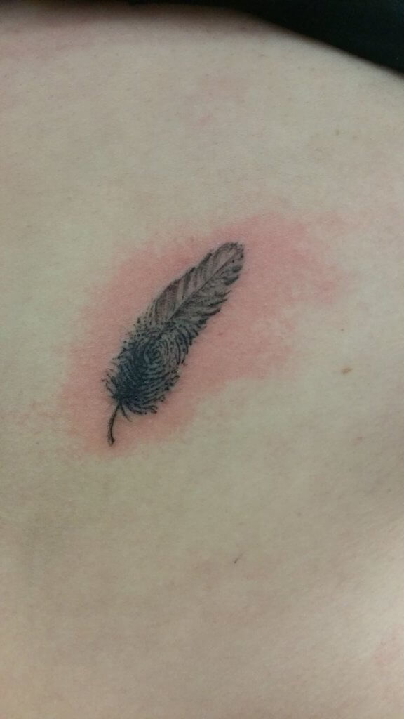 feather thumbprint tattoo