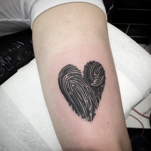 heart shaped thumbprint tattoo