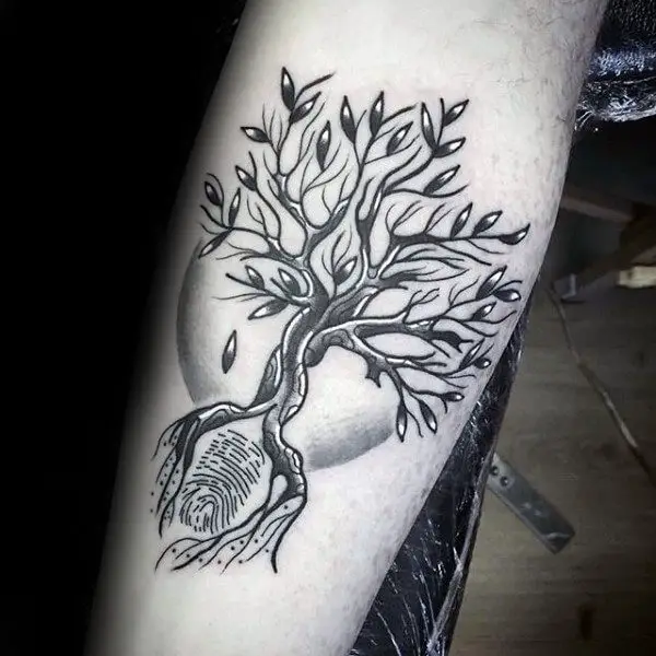 tree-shaped thumbprint tattoo