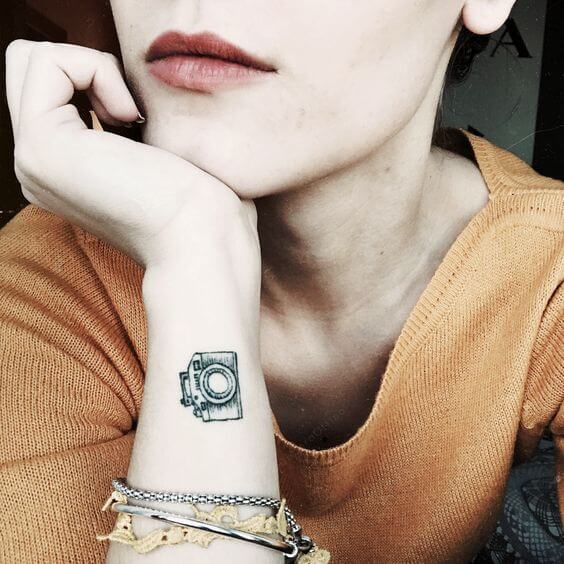 wrist camera tattoo for women