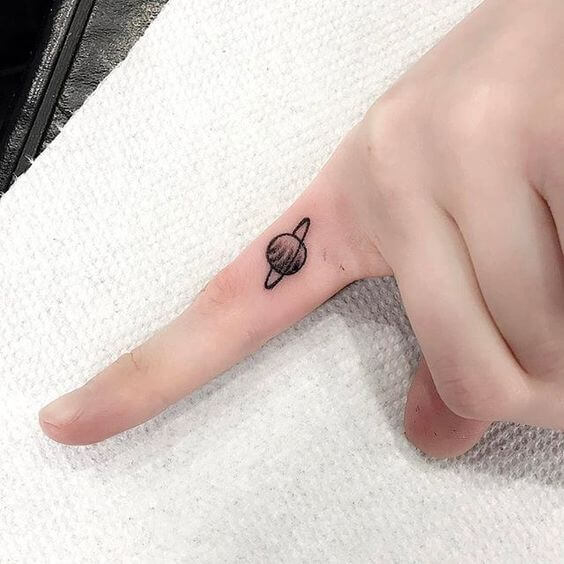 Saturn Finger Tattoo