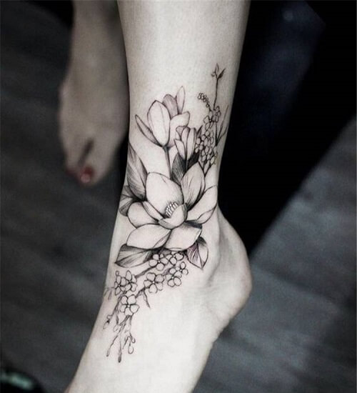 Ankle Flower Tattoo Extending Down the Foot